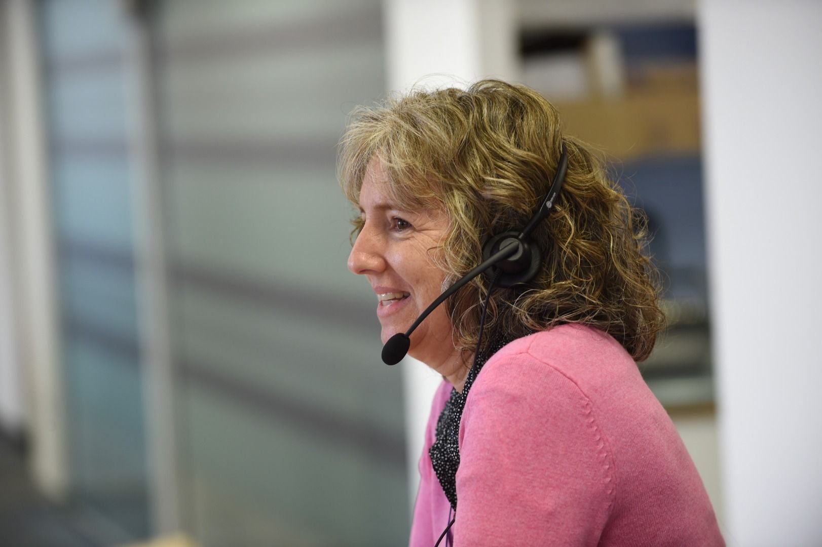 An employee wearing a headset